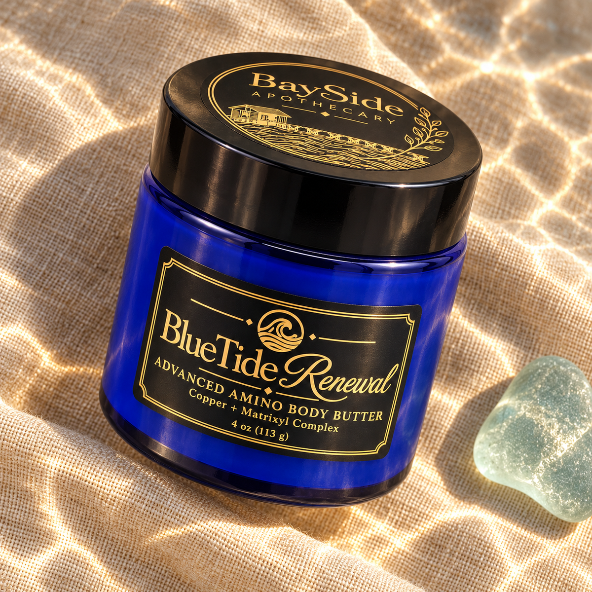 Close-up of the cobalt-blue BlueTide Renewal body butter jar and black-and-gold label.