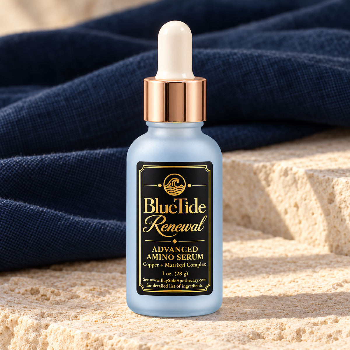 Close-up of BlueTide Renewal serum packaging with its rose-gold collar and white dropper.