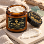 Open Ocean's Ebb body butter jar showing its rich white texture beside a small swatch.