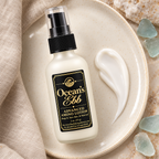 Ocean's Ebb lotion bottle beside a smooth white lotion swatch on ivory ceramic.